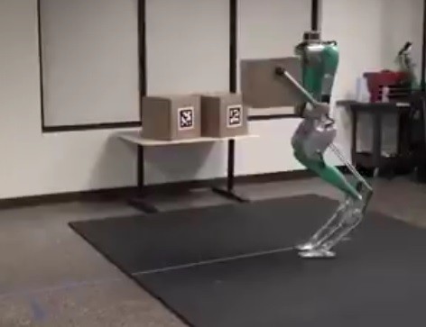 Digit Robot made by Agility Robotics and bought by Ford, Makes a firm grip with the Box using its two arms